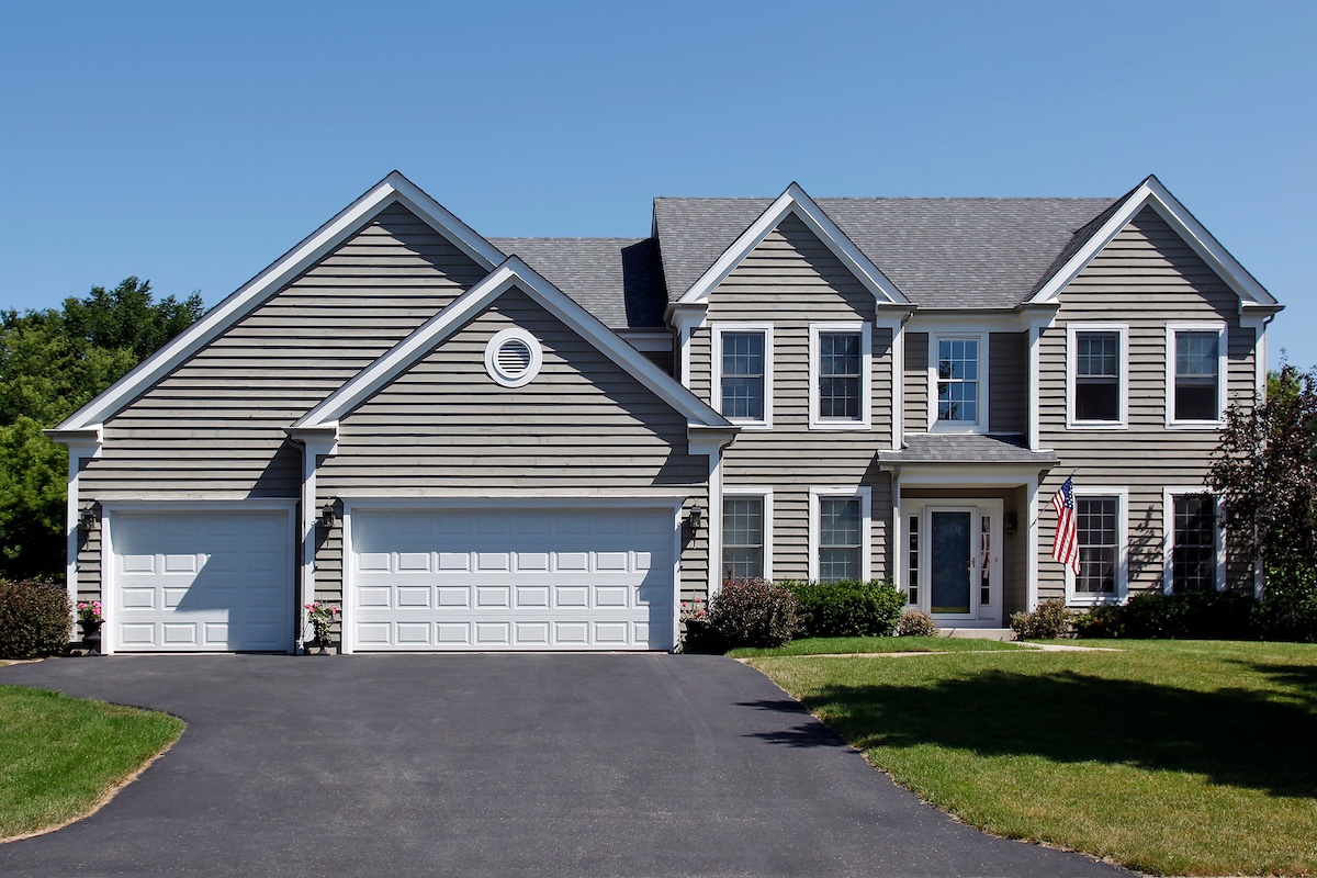 Suburban home with gray siding and covered entry