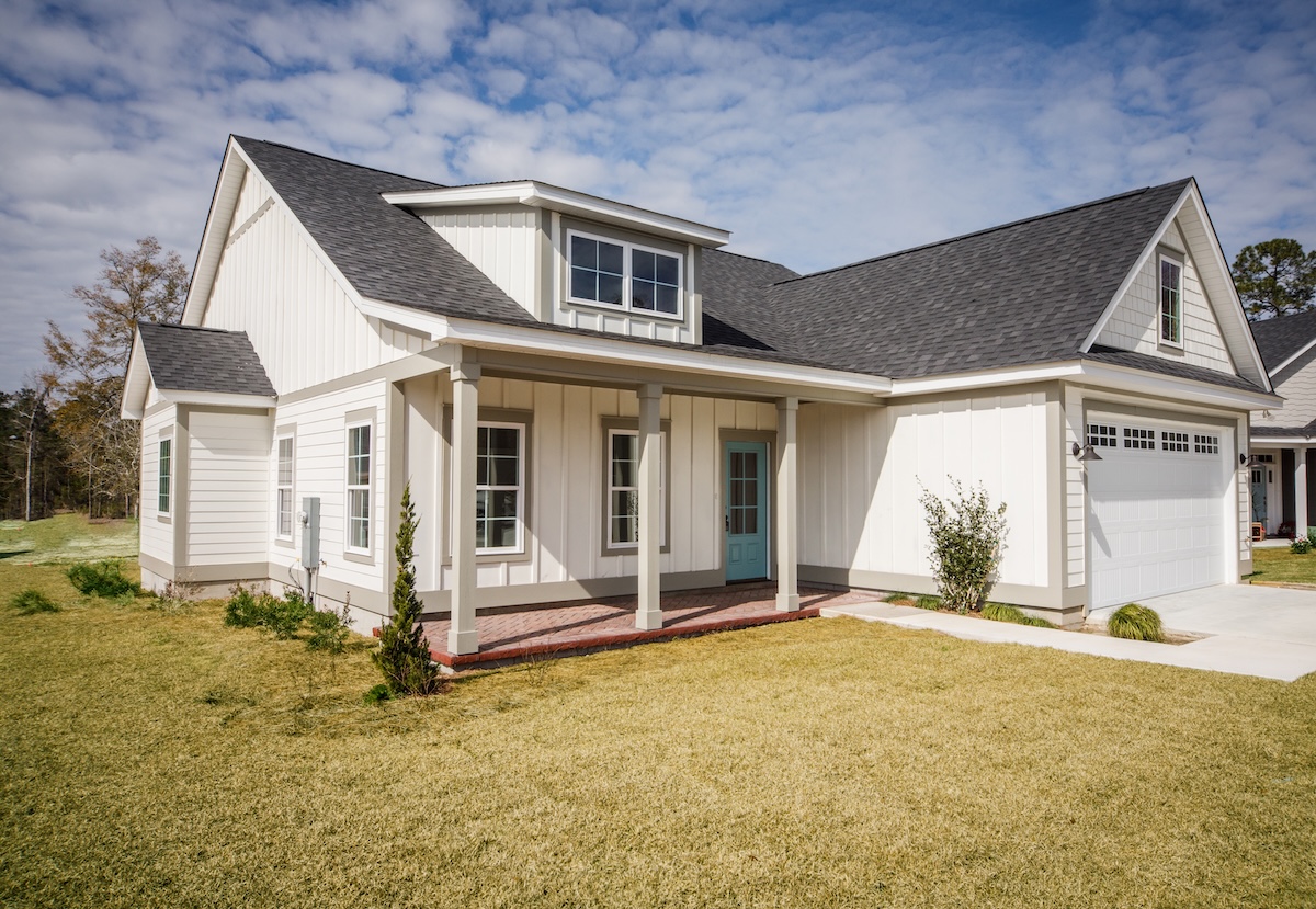 Modern new Construction White Siding Cottage House for Sale in Suburbs with Turquoise Door