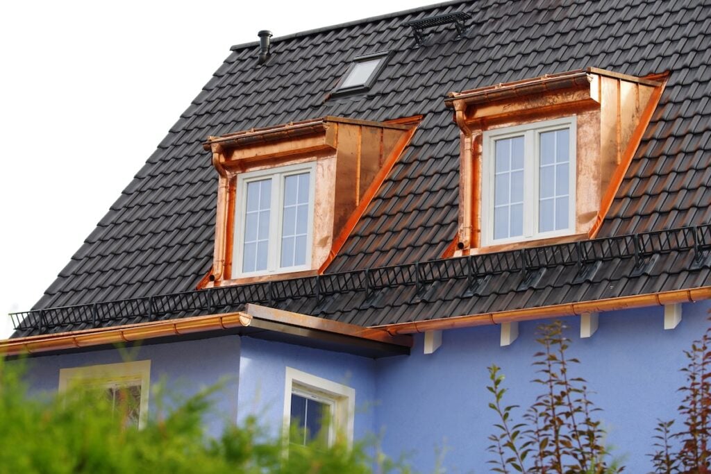 a black metal roof copper accent