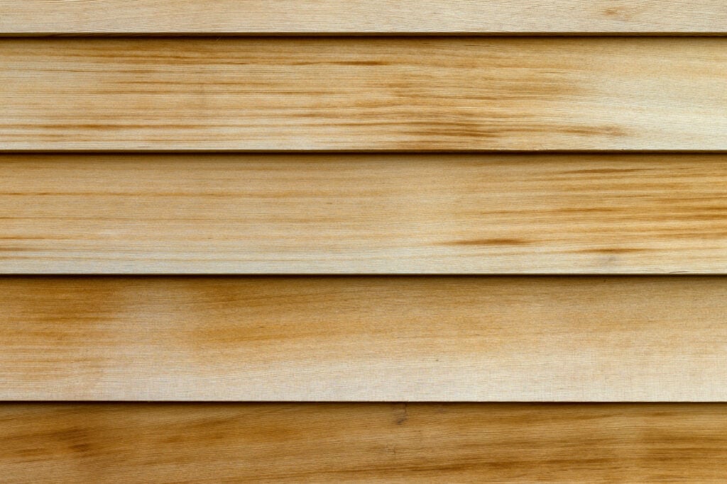 Close view of horizontal rows of cedar wood siding