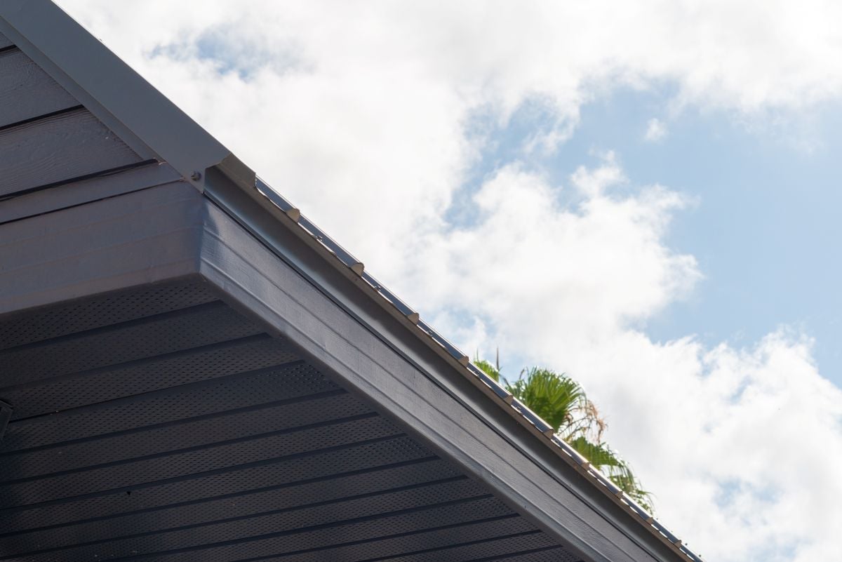 installing drip edge on existing roof close upcloudy sky close