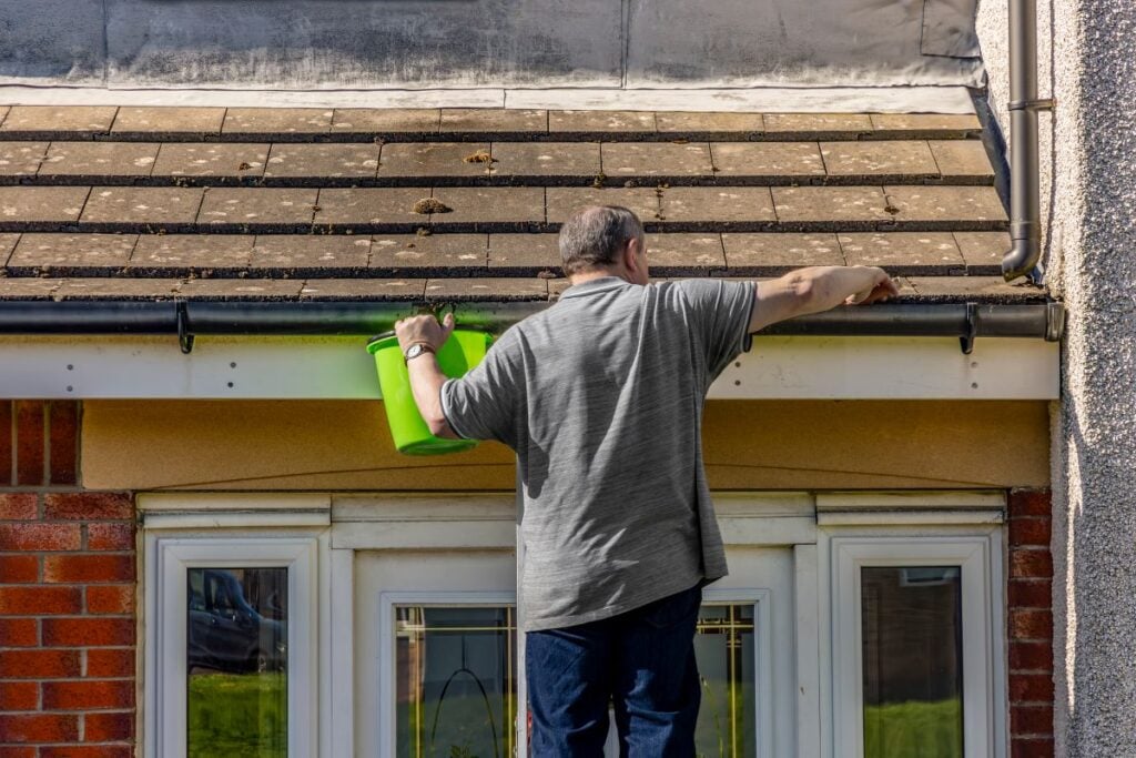how to remove moss from roof naturally man cleaning roof and removing dirt