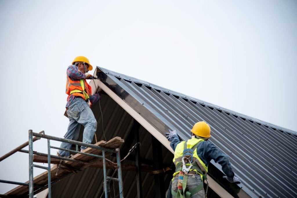 guys installing corrugated metallic roof