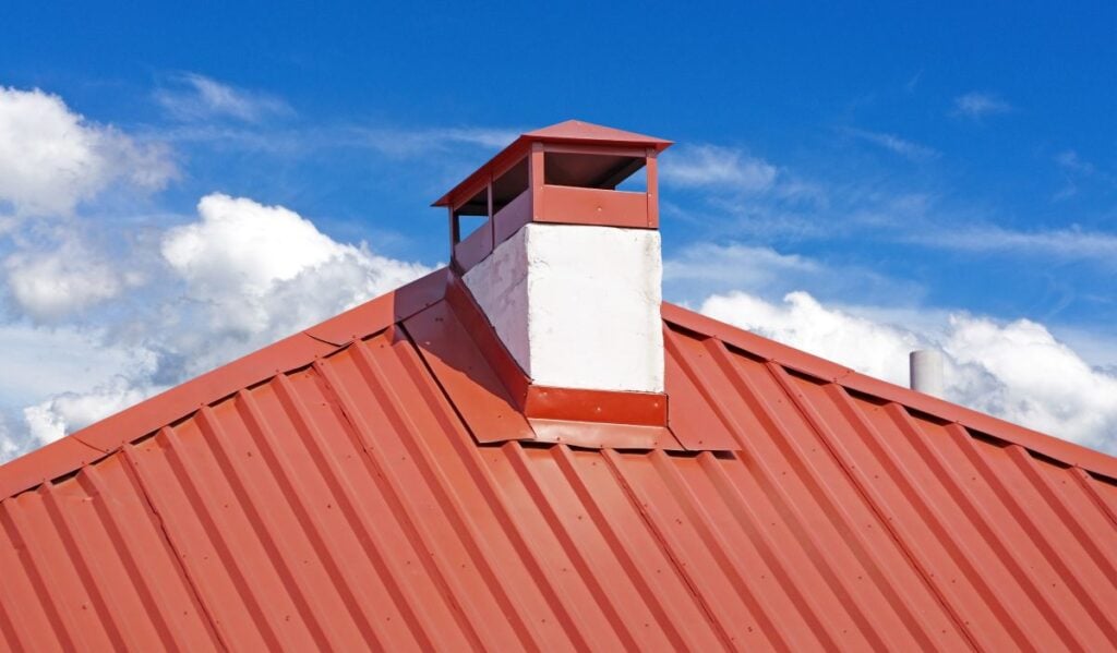 orange metallic roof with chimney