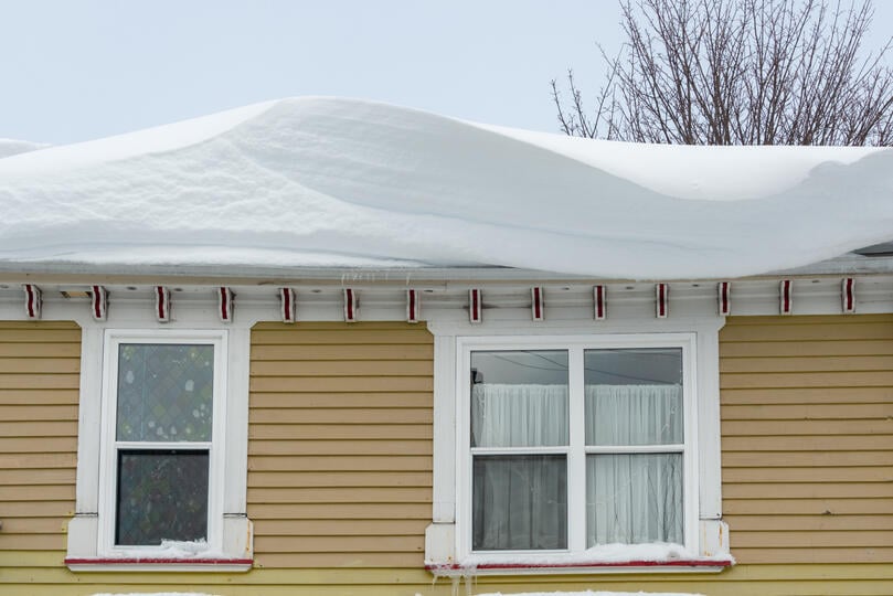 heavy snow on top of roof 